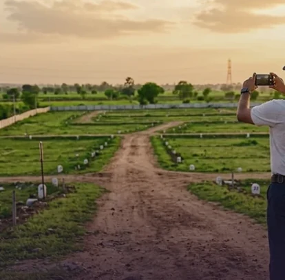 A field inspector documenting a plotted property